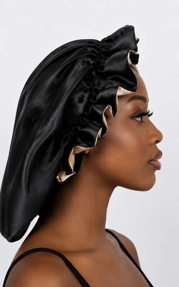 Profile portrait wearing the black satin bonnet